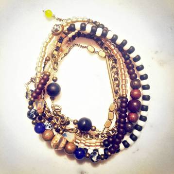 Spanjer handmade beaded chain necklace with fire agate, Tibetan agate, black onyx, jade, wood, and brass. (Photo courtesy of Carolyn Janus.)